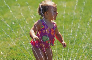 girl in sprinkler